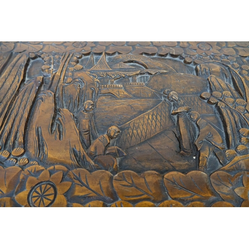 951 - An oriental camphor wood bedding box with extensive carved wood decoration, length