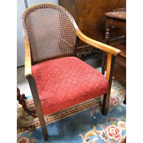 964 - A 1930's cane back armchair; a 19th century brown chair.