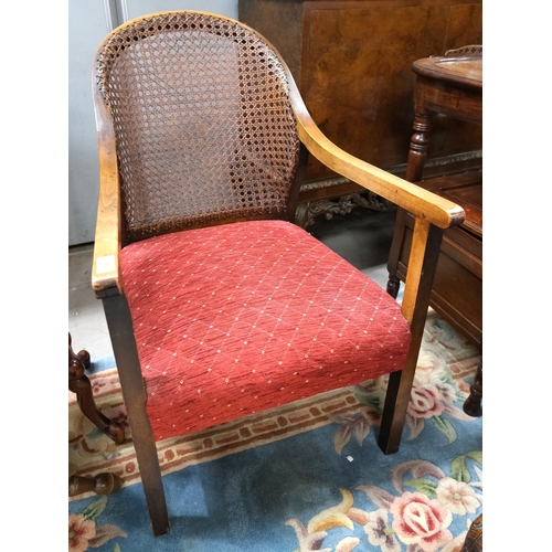 964 - A 1930's cane back armchair; a 19th century brown chair.