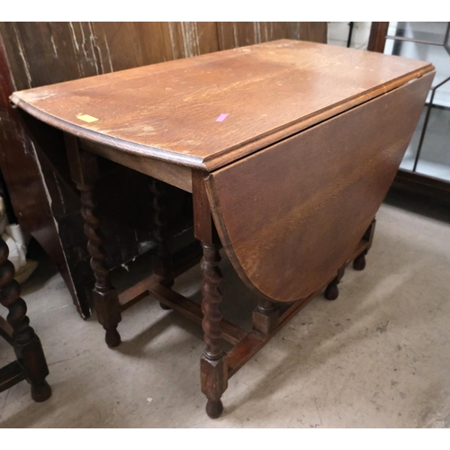 987 - An oak drop leaf barley twist table, length 106cm