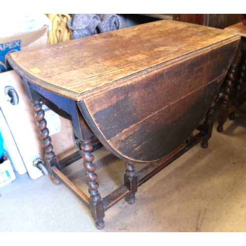 988 - An oak drop leaf barley twist table, length 106cm and 2 dining chairs