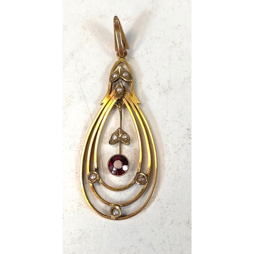 705 - An Edwardian 9ct gold oval openwork pendant set garnet and seed pearls, 2.7gm