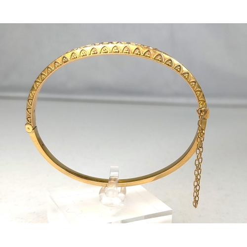 712 - A yellow metal bracelet set with graduating diamonds, unusual, tests as 14ct, 8.6gms