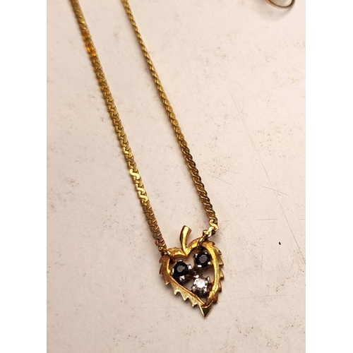 704 - A 9ct gold chain with gems et leaf pendant, 2 other 9K chains and a pair of earrings, 7.6gm