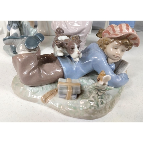 623 - A Lladro group of a boy with his dog; 8 Nao figures of children