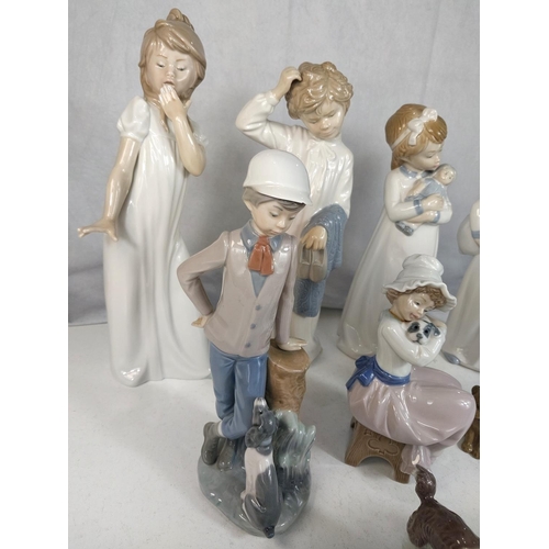 623 - A Lladro group of a boy with his dog; 8 Nao figures of children