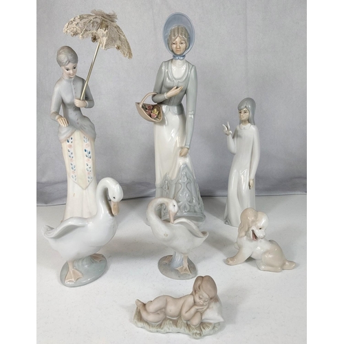 597 - A large Lladro style figure of ladies and 5 smaller Lladro style figures and birds.