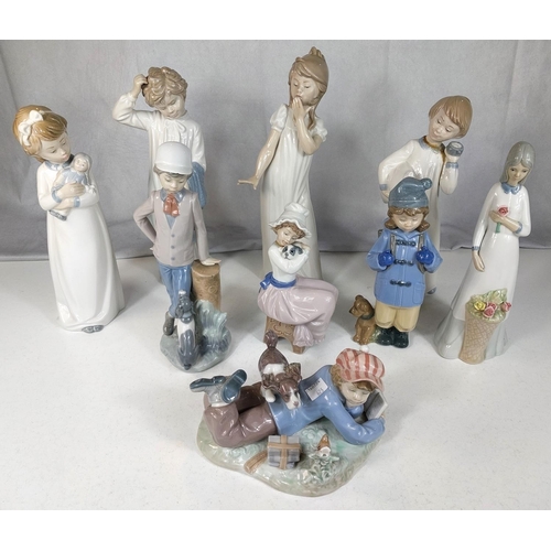 623 - A Lladro group of a boy with his dog; 8 Nao figures of children