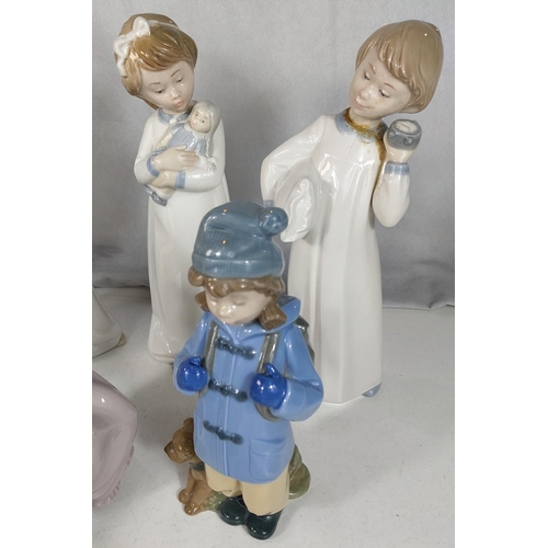 623 - A Lladro group of a boy with his dog; 8 Nao figures of children