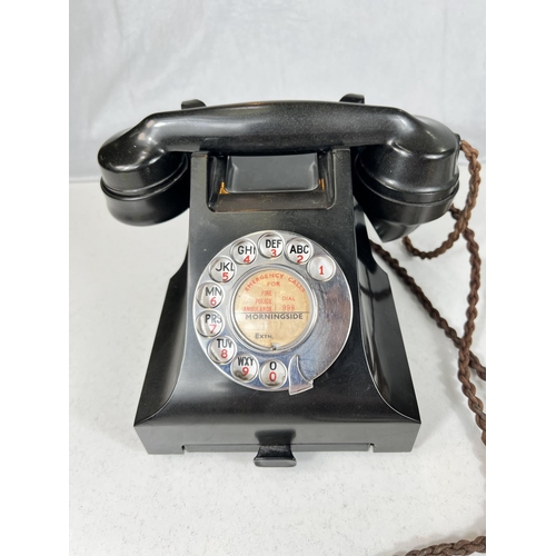 18B - A black Bakelite rotary telephone and thermometer barometer