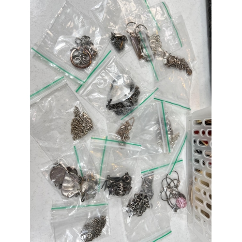 791 - A selection of silver chains, coins, bracelets and various silver compacts.