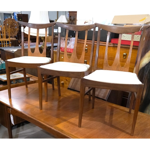 851 - A mid 20th century G-Plan 'Brasilia' teak dining suite comprising extending rounded rectangular tabl... 