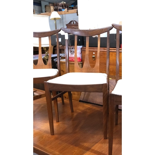 851 - A mid 20th century G-Plan 'Brasilia' teak dining suite comprising extending rounded rectangular tabl... 