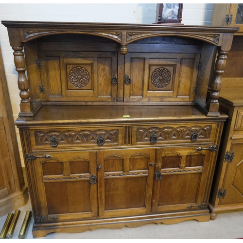 853 - A reproduction golden oak carved buffet sideboard with double cupboard above and below and two drawe... 