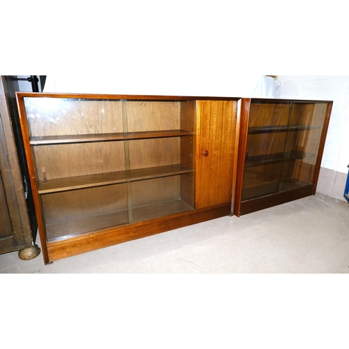 856 - A mid 20th century Autograph Sapele bookcase with sliding doors and single cupboard and another simi... 