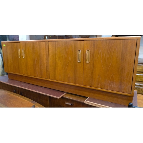 910 - A 1960's G-Plan teak sideboard of long low form