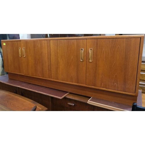 910 - A 1960's G-Plan teak sideboard of long low form