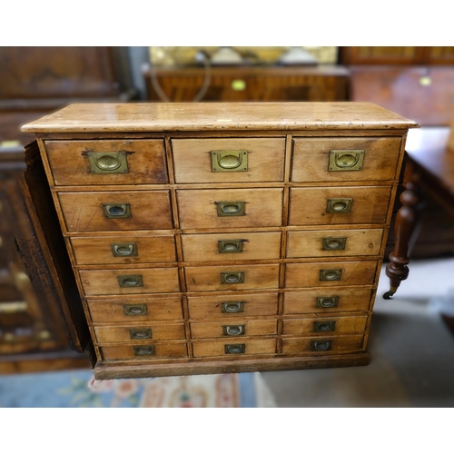 916 - A pine 21 drawer stripped pine cabinet