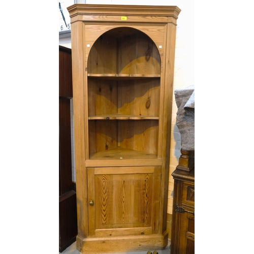 936 - A reproduction pine full height corner cupboard with 3 open shelves and cupboard below