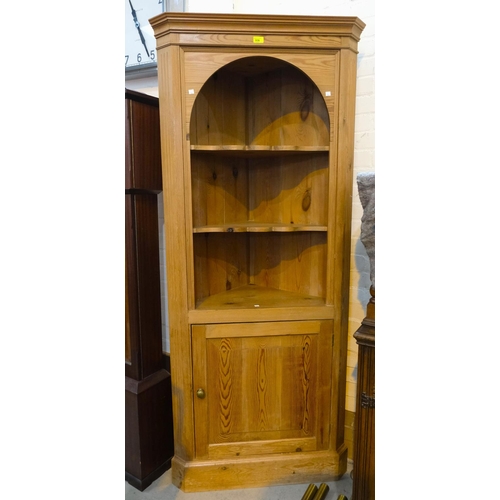 936 - A reproduction pine full height corner cupboard with 3 open shelves and cupboard below