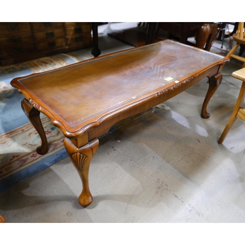 972 - A rectangular figural mahogany coffee table and a similar nest of tables.