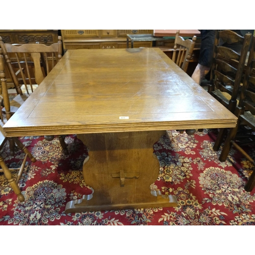 977 - A golden oak draw leaf dining table with stretcher base, unextended 152cm, 214cm extended length and... 