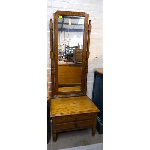 981 - A golden oak full height cheval mirror with drawers below