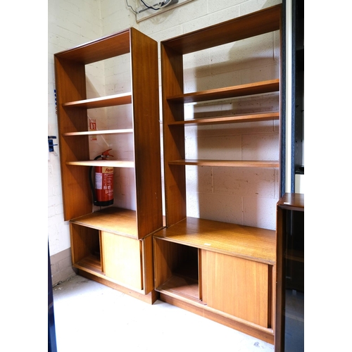 999 - A pair of mid 20th century teak G-plan room divider units with cupboards bellow and open shelves abo... 