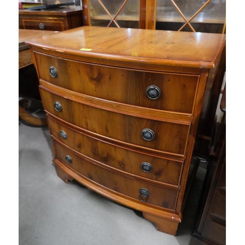 894 - A reproduction yew wood bow front 4 height chest of drawers