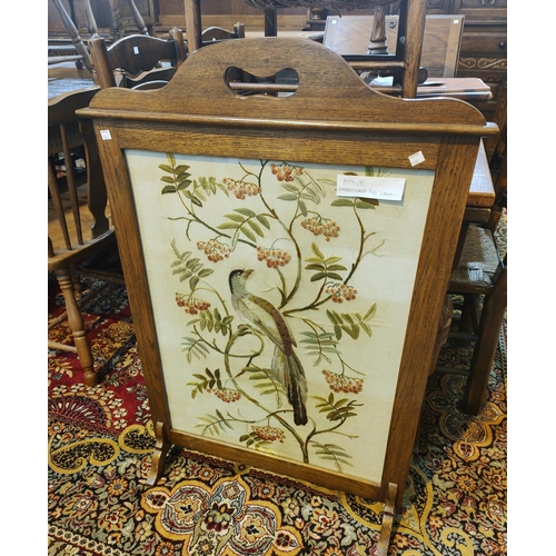 1012 - A large oak tapestry fire screen with bird on branches