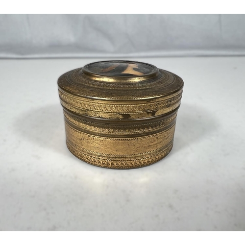 18A - A small gilt circular box with portrait to lid of female