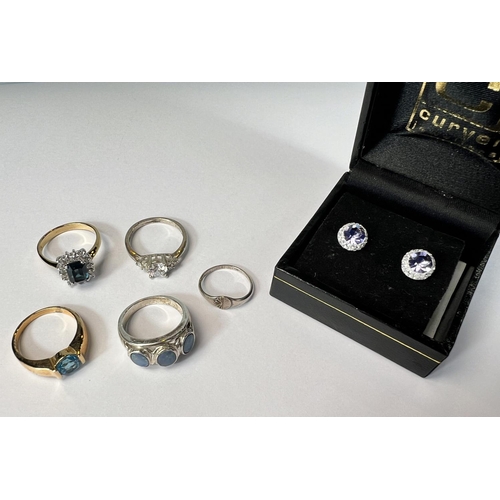 746 - A silver ring set with opals other silver rings etc