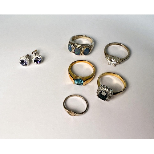 746 - A silver ring set with opals other silver rings etc