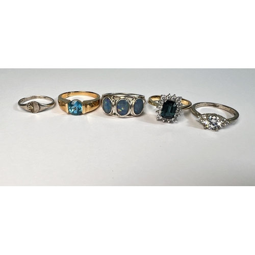 746 - A silver ring set with opals other silver rings etc