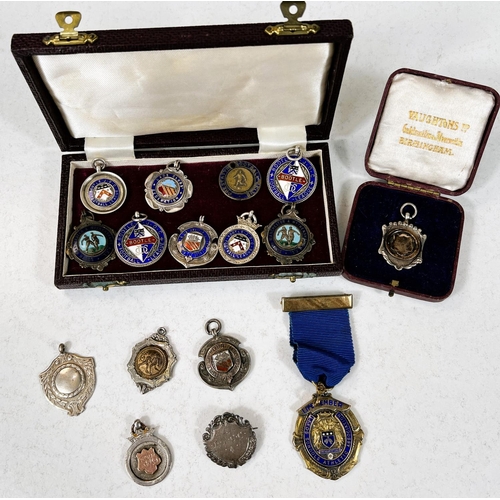 756 - A large quantity of silver and other fob medallions some with enamel some for football etc 