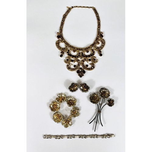 759 - A white metal suite of costume jewellery in floral form, a similar gilt set