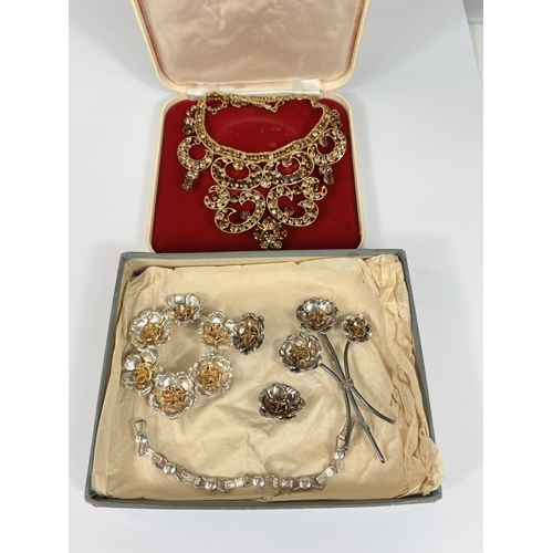 759 - A white metal suite of costume jewellery in floral form, a similar gilt set