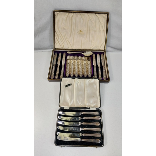 670 - A cased set of silver handled fish knives and forks, a boxed set of silver handled tea knives.