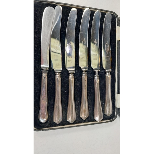 670 - A cased set of silver handled fish knives and forks, a boxed set of silver handled tea knives.