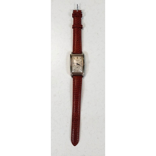 673 - A GENTLEMAN'S WRISTWATCH, by MOVADO c. 1930 in curved rectangular white gold filled case