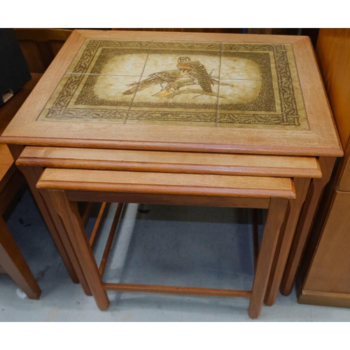 1010A - A nest of mid 20th century Danish teak tile top tables by Mobelfabrikken Toften with falcons