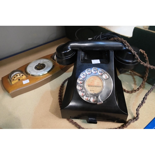 18B - A black Bakelite rotary telephone and thermometer barometer