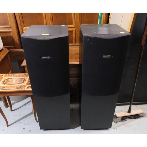 23 - A pair of Celestion speakers 25i, 120 watts per speaker, approx 33 inches high, spiked.