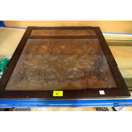 93 - An Arts and Crafts mahogany framed leather panel with floral decoration, 55 x 56 cm; and an African ... 