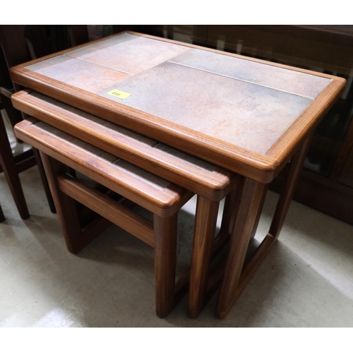 855 - A teak tile top nest of three occasional tables