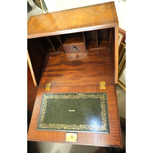 887 - A reproduction mahogany fall front bureau with fitted interior, crossbanded decoration and 4 drawers... 