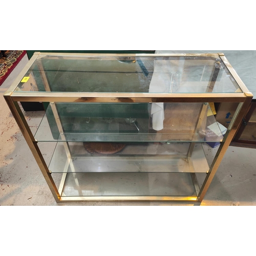 905 - A gilt metal and glass 4 height wall unit.