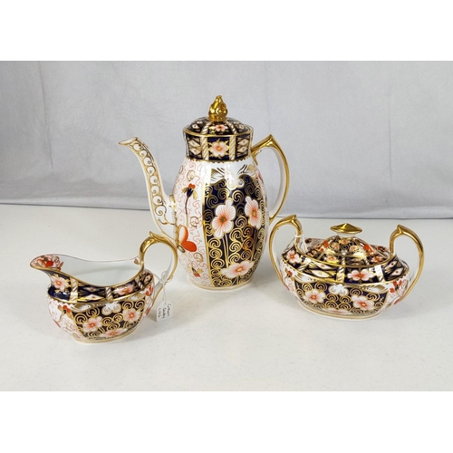 541 - A matched royal Crown Derby coffee pot, sucrier and cream jug.