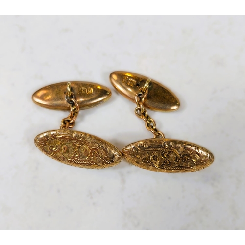 708 - A set of 9ct gold cufflinks with scrolling embossed decoration, 5.4gms