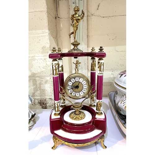 594 - A Louis XV1 style porcelain mantle clock with gilt metal mounts.